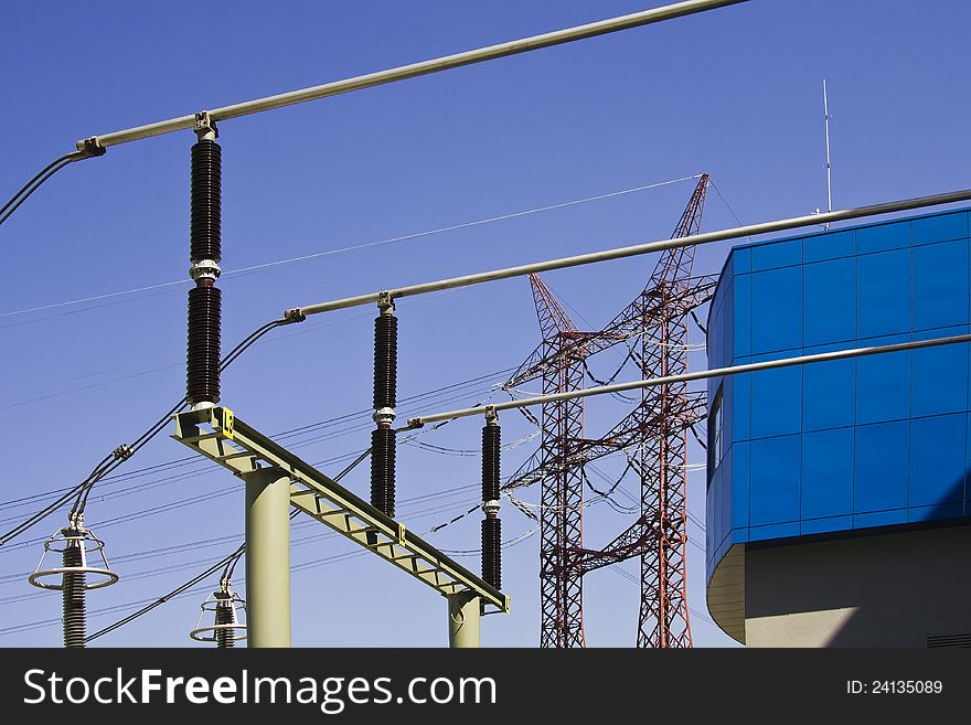 High voltage power isolators and power pylon against blue sky