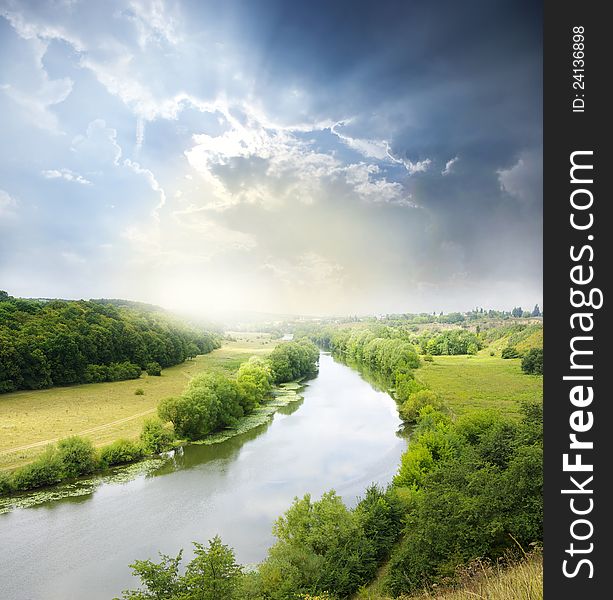 Landscape - meadow, the blue sky and river