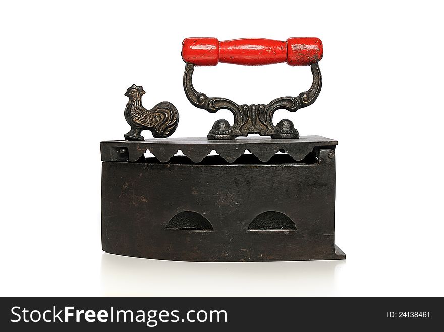 Old vintage iron with red handle isolated on a white background