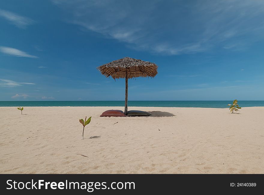 Umbrella and beautiful beach on a sunny day