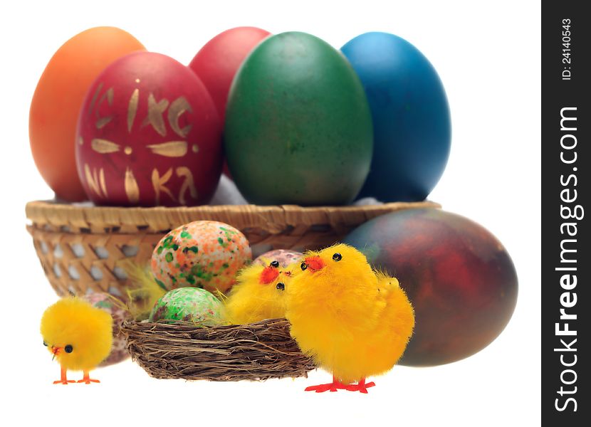 Easter eggs and decorations in a basket. selective focus on chicks