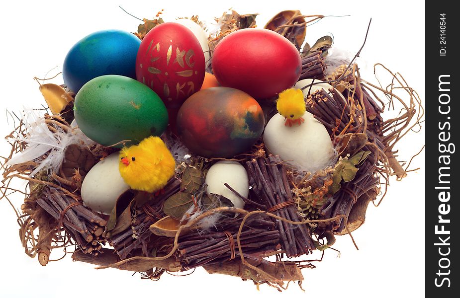 Easter eggs and decorations in a basket. selective focus on chicks