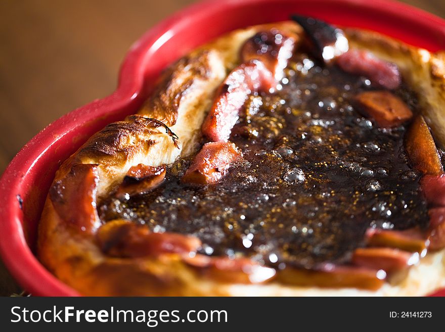 Pieces of jam strawberry pie in table