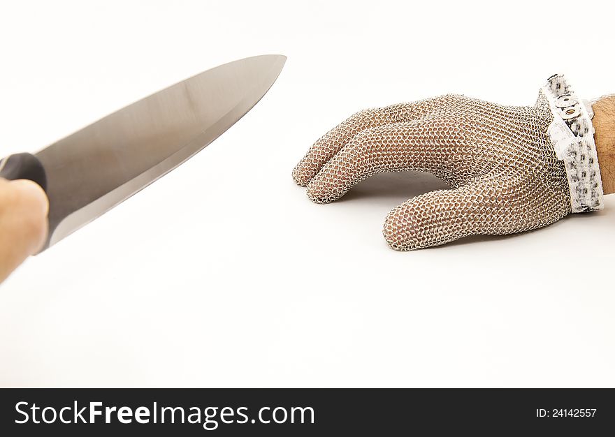 Hand of a worker with a mesh glove anticut. Hand of a worker with a mesh glove anticut