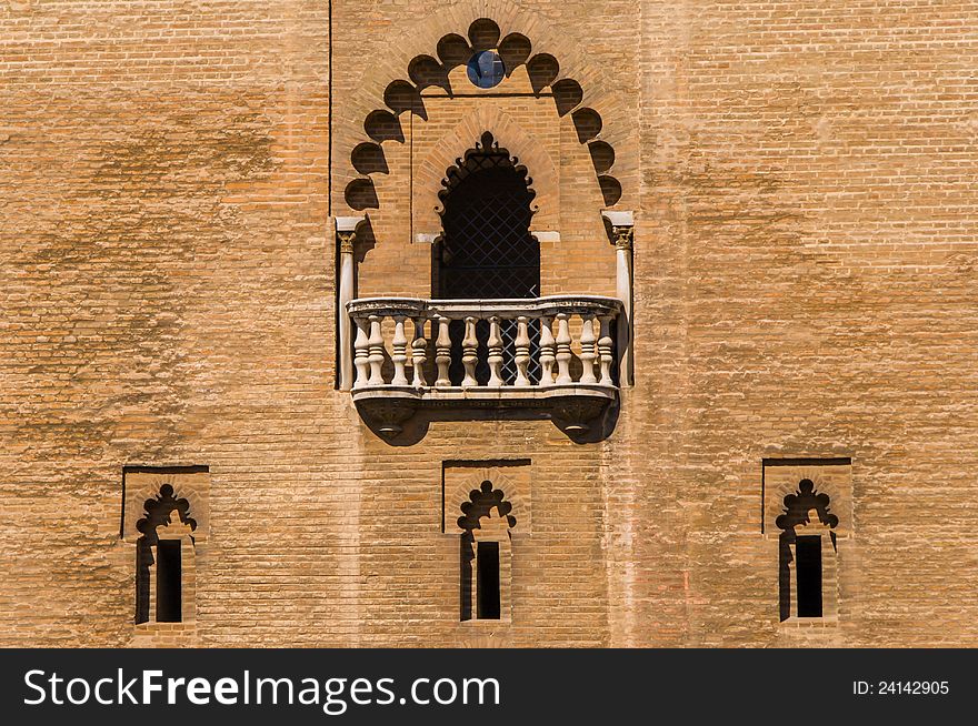 Arabic-style wall with 3 windows and one open balcony above. Arabic-style wall with 3 windows and one open balcony above.