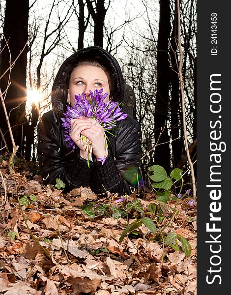 Girl with snowdrops in the hands of