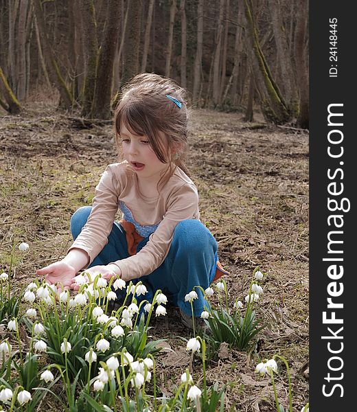 Girl in the forest with flowering snowflake. Girl in the forest with flowering snowflake