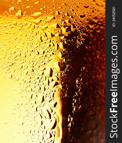 Close-up picture of a golden bubbles of a beer on the glass. Close-up picture of a golden bubbles of a beer on the glass.