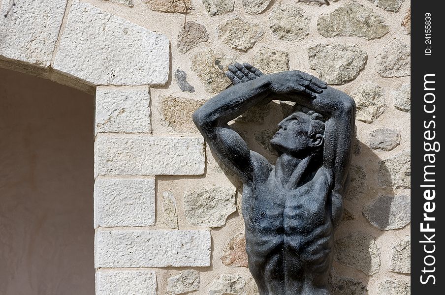 Statue beside a doorway in Toledo Spain. Statue beside a doorway in Toledo Spain