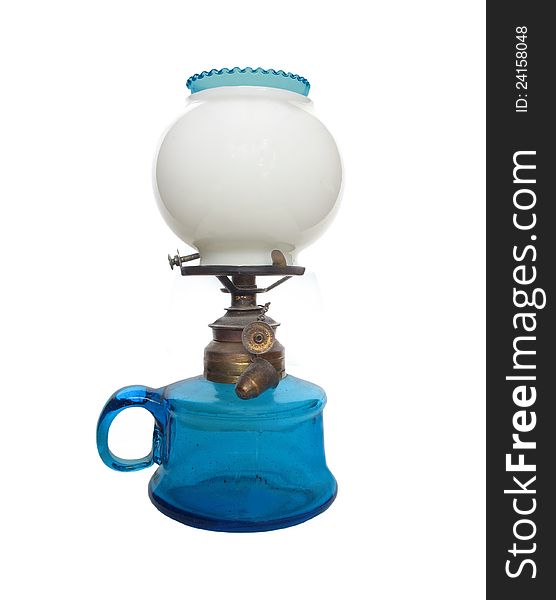 Antique blue glass oil lamp with a white globe. Isolated on white. Antique blue glass oil lamp with a white globe. Isolated on white.