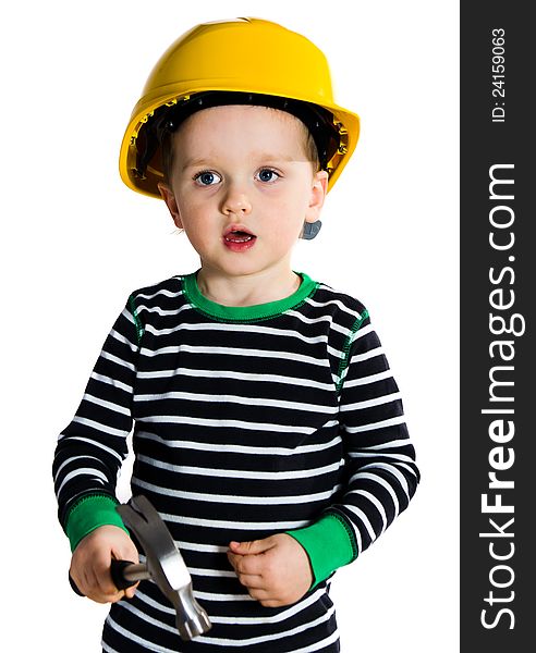 Funny little boy in yellow helmet playing with hammer. Funny little boy in yellow helmet playing with hammer