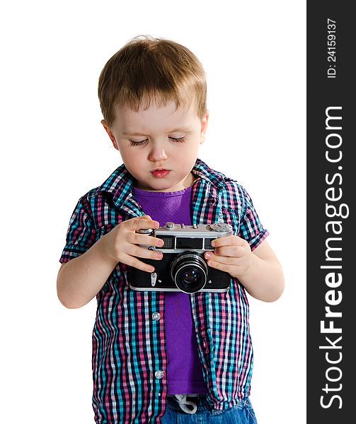 Boy playing with retro analogue photo camera - isolated on white background. Boy playing with retro analogue photo camera - isolated on white background