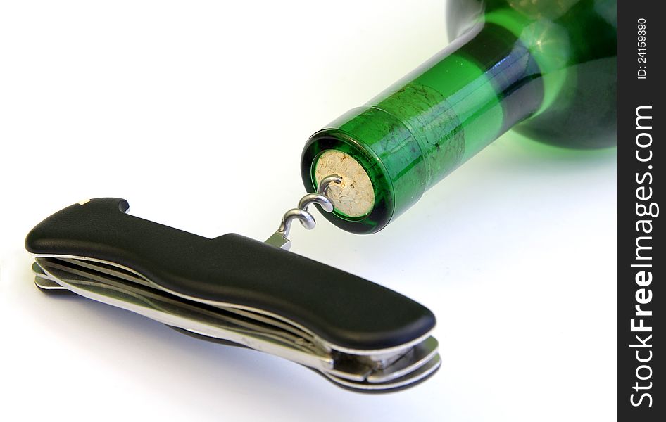 Bottle of vine opened by pocket knife. Bottle of vine opened by pocket knife