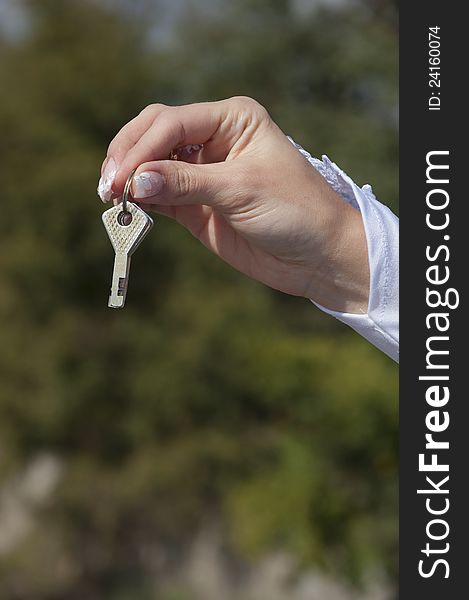 Hand of the bride with two keys. Hand of the bride with two keys