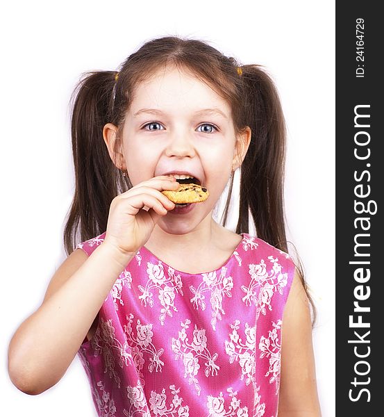 Little pretty girl eating cookie, over white. Little pretty girl eating cookie, over white