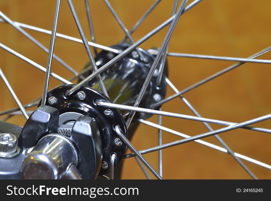 Bicycle wheel fragment; focus on front spokes. Bicycle wheel fragment; focus on front spokes