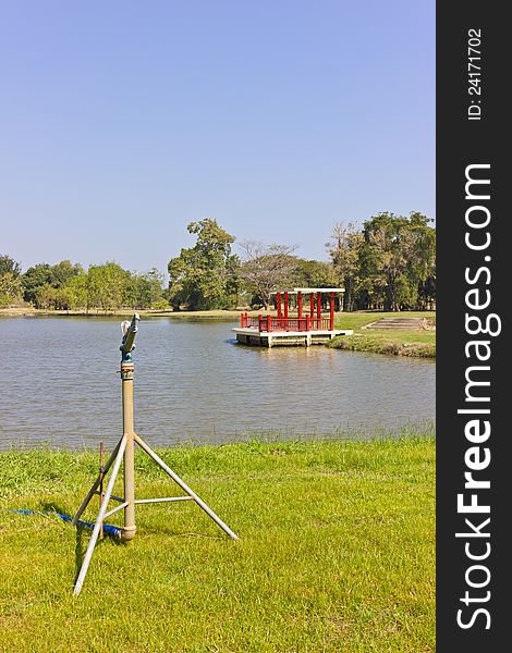 Sprinkler is placed near the lake. Sprinkler is placed near the lake.