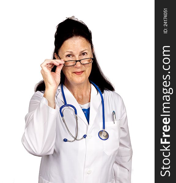 A mature woman doctor grinning and looking over her glasses. Everyone likes a friendly doctor. Isolated on white. A mature woman doctor grinning and looking over her glasses. Everyone likes a friendly doctor. Isolated on white.