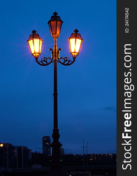 City lamp light at night, and blue sky. City lamp light at night, and blue sky