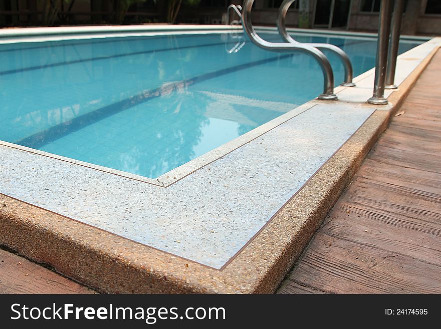 Close-up of swimming pool with stair at hotel , vacation background. Close-up of swimming pool with stair at hotel , vacation background