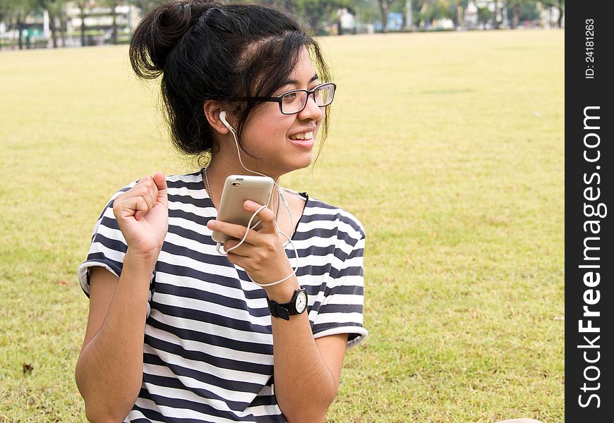 Woman Relaxing And Listening To Music