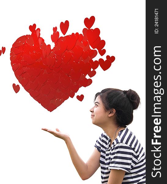 Romantic young woman holding a big heart composed of small red hearts in hands. Romantic young woman holding a big heart composed of small red hearts in hands