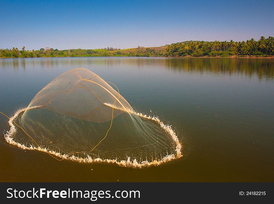 An unusual composition of a usual throwing-fishing net photo. An unusual composition of a usual throwing-fishing net photo