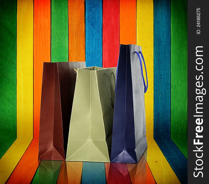 Shopping Bags On Colorful Wood