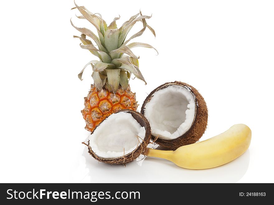 Tropical fruits isolated on white background. Coconut, banana and pineapple. Fresh summer fruits. Tropical fruits isolated on white background. Coconut, banana and pineapple. Fresh summer fruits.