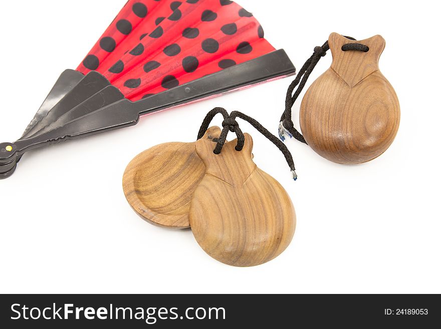 Castanets with traditional Spanish fan with white background. Castanets with traditional Spanish fan with white background