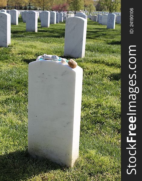 A headstone with rocks at Arlington National Cemetery