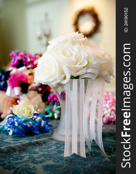 A white rose wedding bouquet in a vase of water