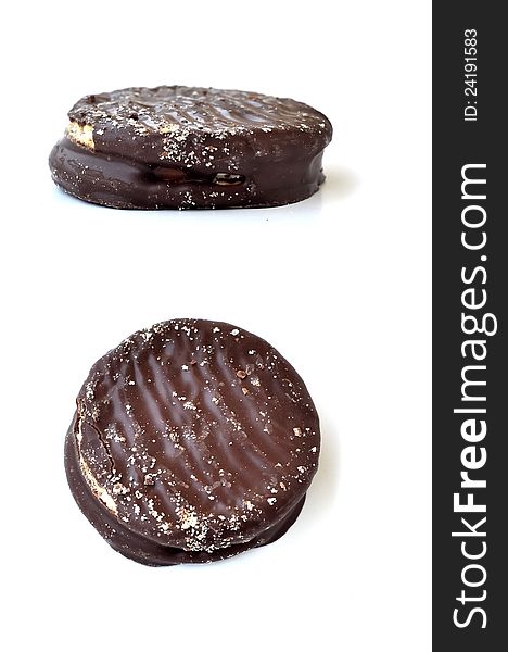 Two views of a biscuit with chocolate layer covering it. Two views of a biscuit with chocolate layer covering it