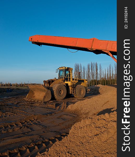 Earth moving digger in a quarry