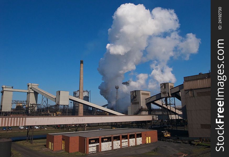 Industrial chimneys billowing steam. Industrial chimneys billowing steam.