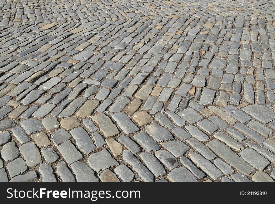 Old pavement, historic cobbles, and background. Old pavement, historic cobbles, and background.