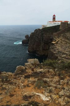 Lighthouse On A Cape Stock Photos