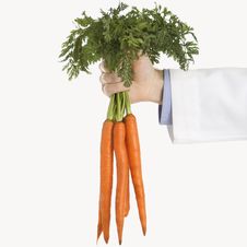 Doctor Holding Carrots Royalty Free Stock Photos Doctor Holding Carrots Royalty Free Stock Photos