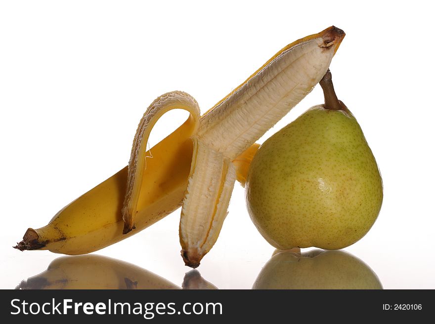 Ripe banana and pear on a white background