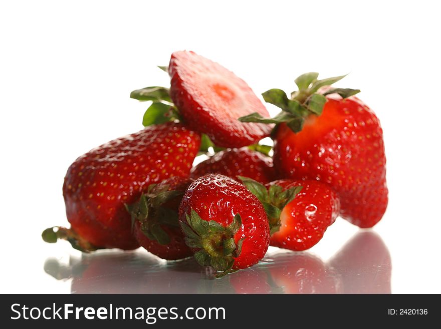Ripe juicy strawberry on a white background