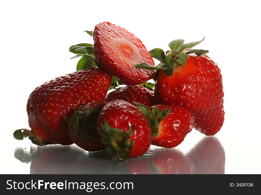 Ripe juicy strawberry on a white background