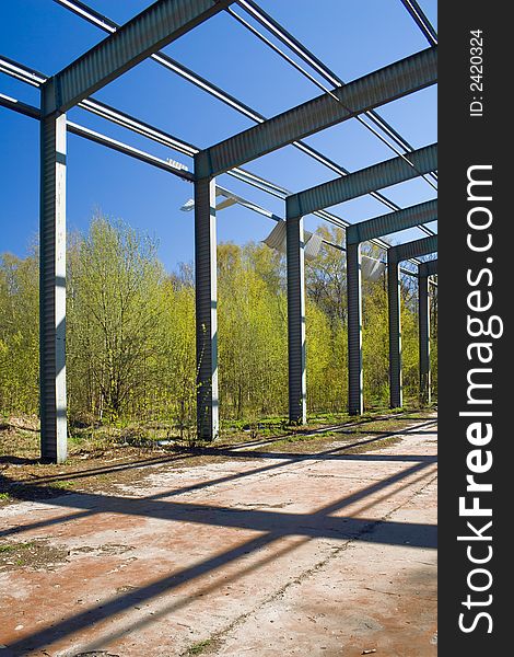 Fragment of an abandoned steel hangar. Fragment of an abandoned steel hangar