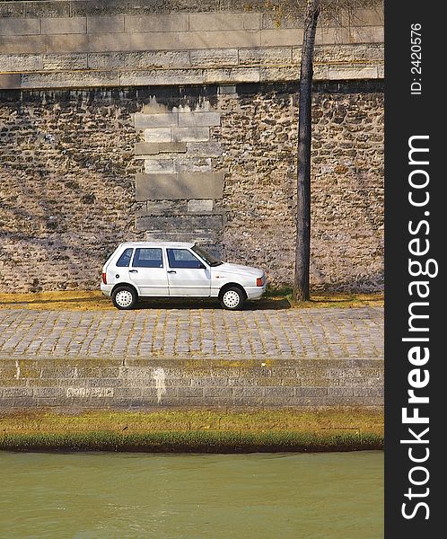 Lone car on Paris quay from the left bank of Seine