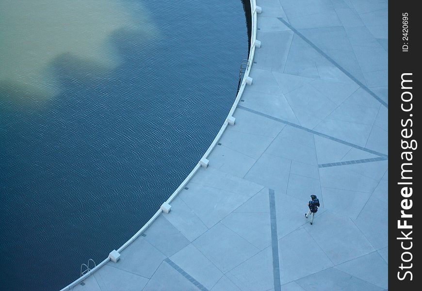 Backpacker in the Melbourne Docklands Precinct near the Yarra River. Backpacker in the Melbourne Docklands Precinct near the Yarra River