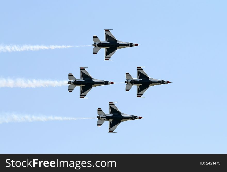 A fighter formation at a air show. A fighter formation at a air show