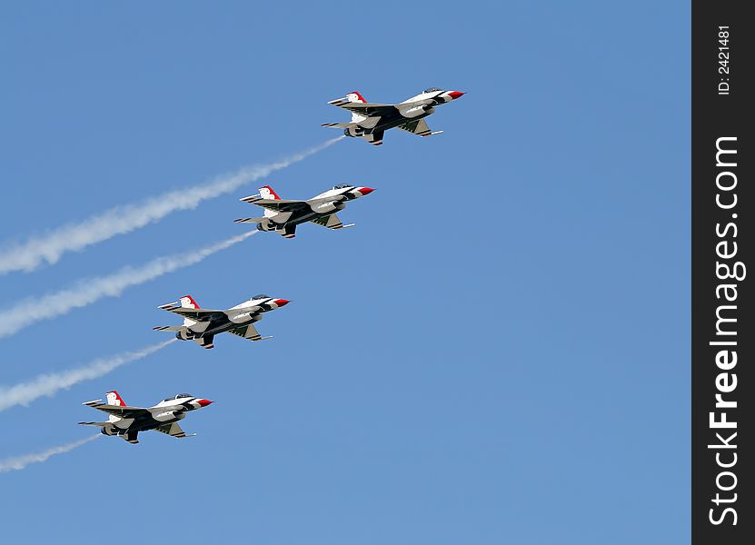 A fighter formation at a air show. A fighter formation at a air show