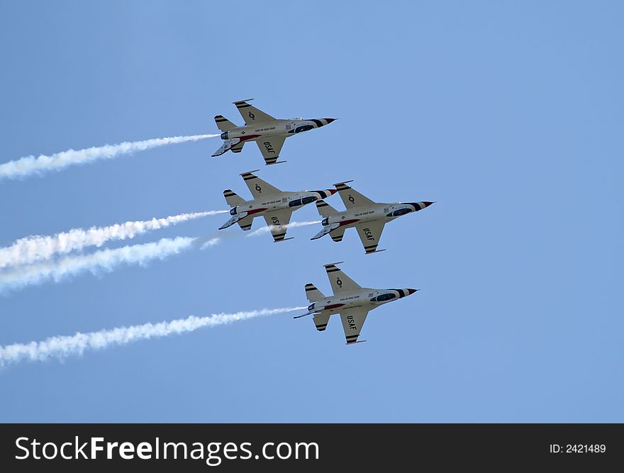 A fighter formation at a air show. A fighter formation at a air show