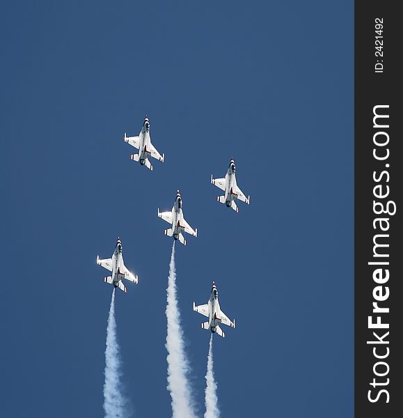 A fighter formation at a air show. A fighter formation at a air show