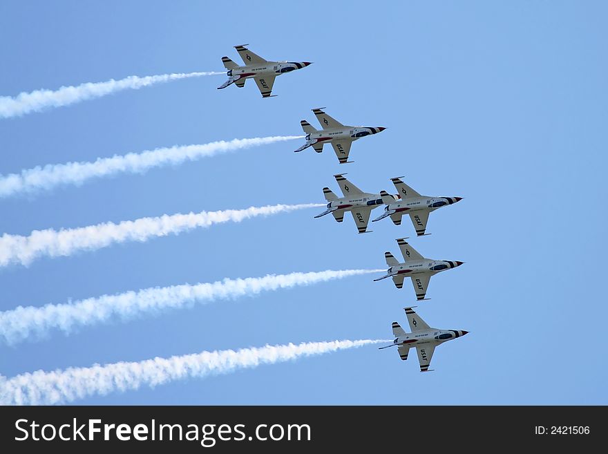 A fighter formation at a air show. A fighter formation at a air show