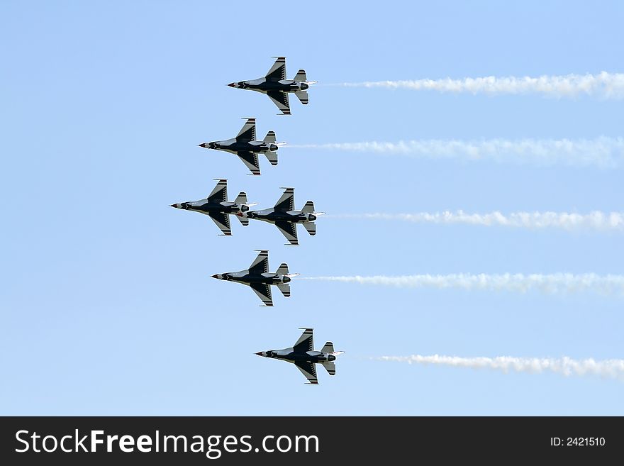 A fighter formation at a air show. A fighter formation at a air show